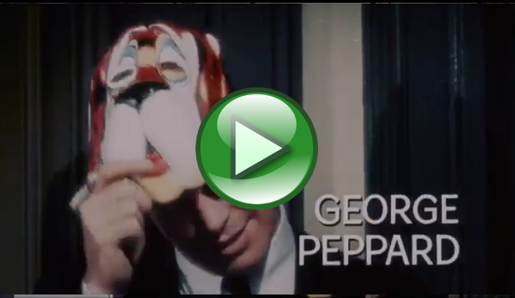 视频缩略图显示一个人靠近脸部举着一个彩色面具，叠加的文字是“GEORGE PEPPARD”（得分0.1237）。