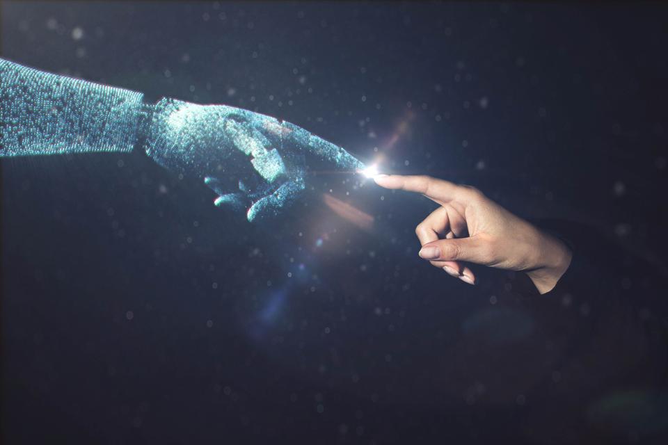 Artificial intelligence robot finger touching to human finger